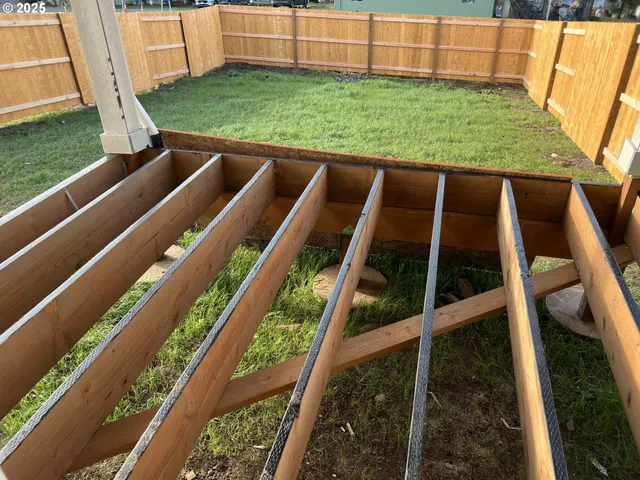 a view of a backyard with chairs