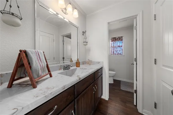 a bathroom with a sink a vanity and mirror