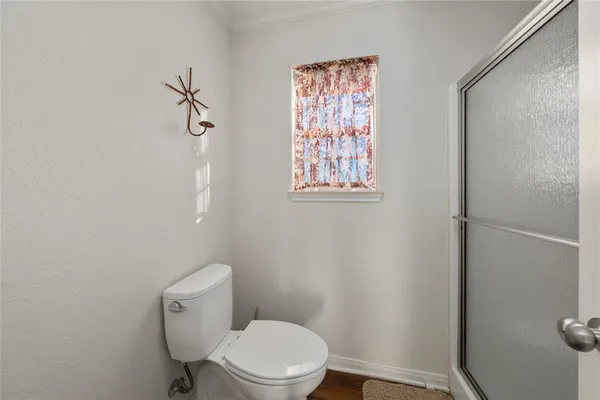 a white toilet sitting next to a bathroom sink