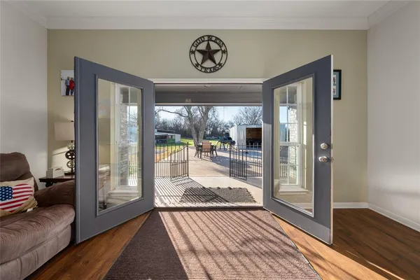 a view of a livingroom with furniture and front door
