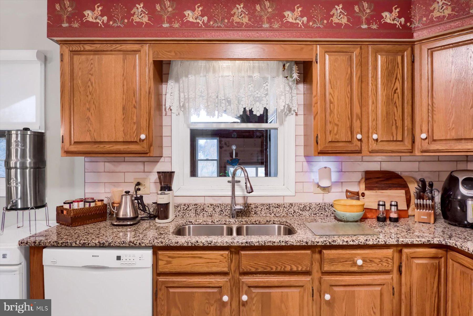 1105 Red Hill Road Port Trevorton, PA 17864 - Photo 18 of 71 a kitchen with granite countertop a sink and cabinets
