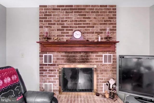a bedroom with a bed and a dresser in it