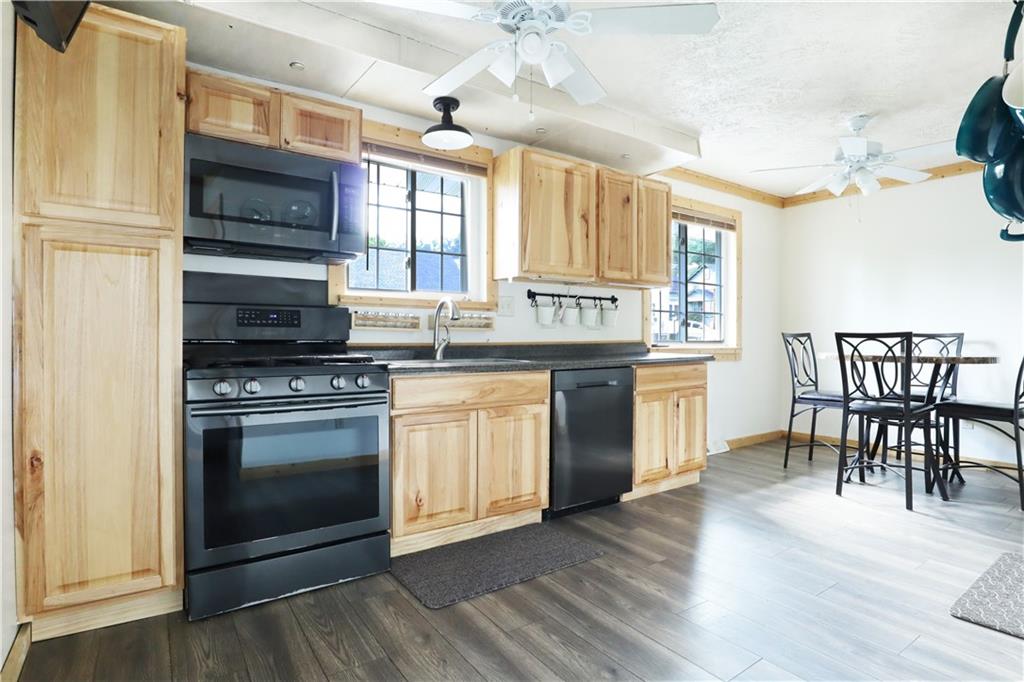 46 Rural Avenue Washington, PA 15301 - Photo 2 of 22 a kitchen with stainless steel appliances granite countertop a stove a sink and a refrigerator