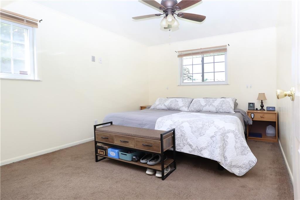 46 Rural Avenue Washington, PA 15301 - Photo 9 of 22 a bedroom with a bed and a chandelier
