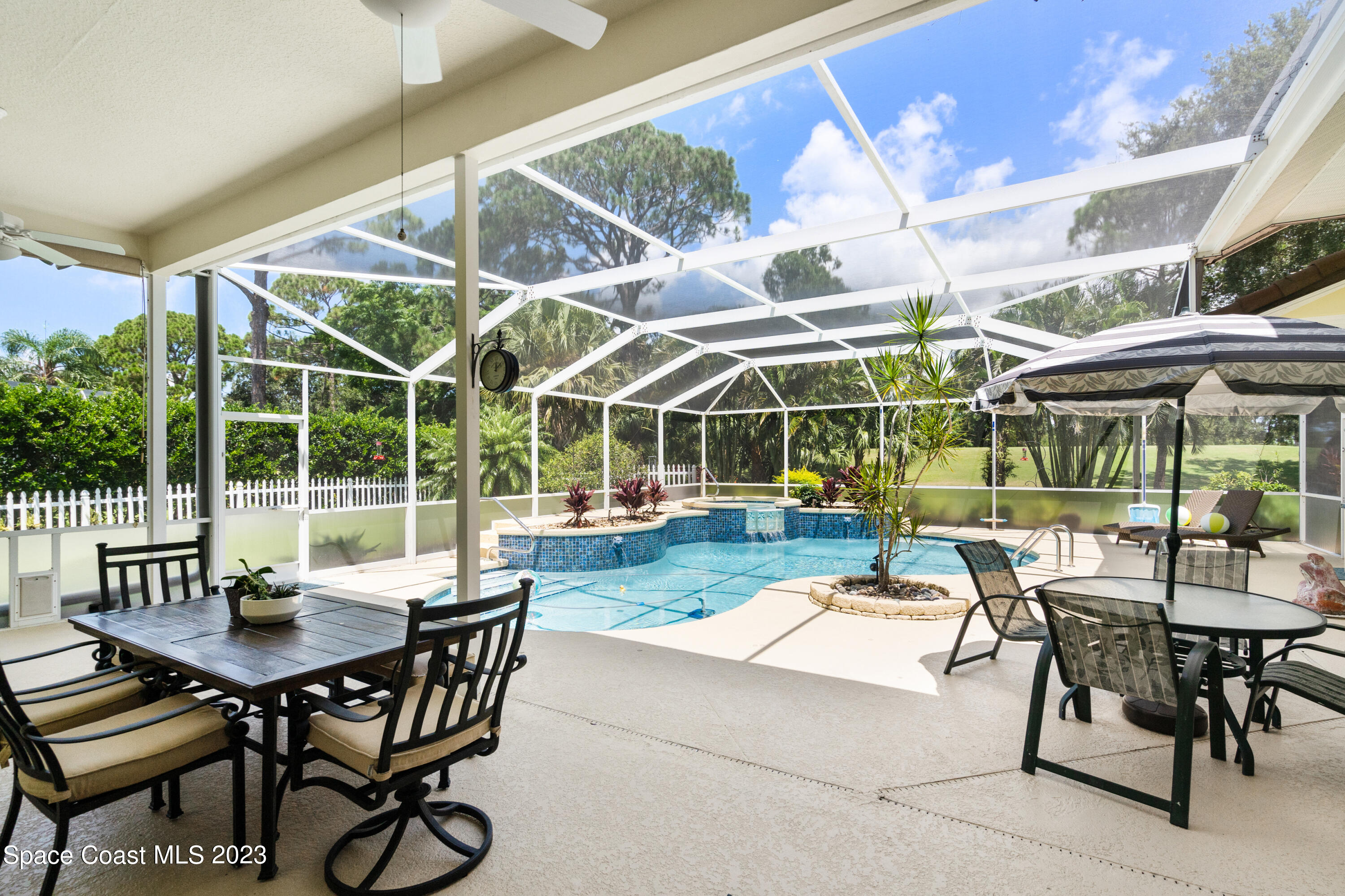 Undisclosed Address Vero Beach, FL 32967 - Photo 15 of 36 a view of a patio with a table and chairs