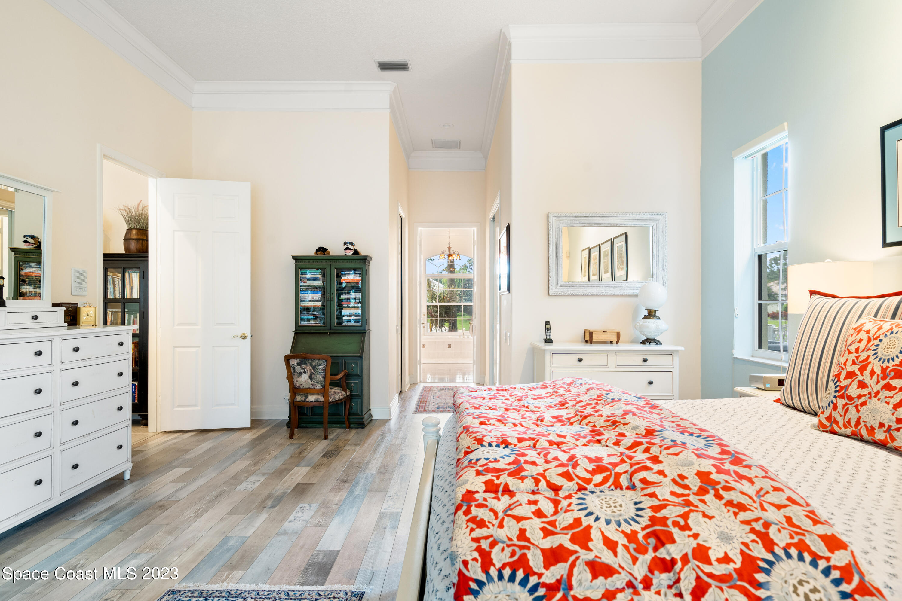 Undisclosed Address Vero Beach, FL 32967 - Photo 19 of 36 a bedroom with a bed and wooden floor