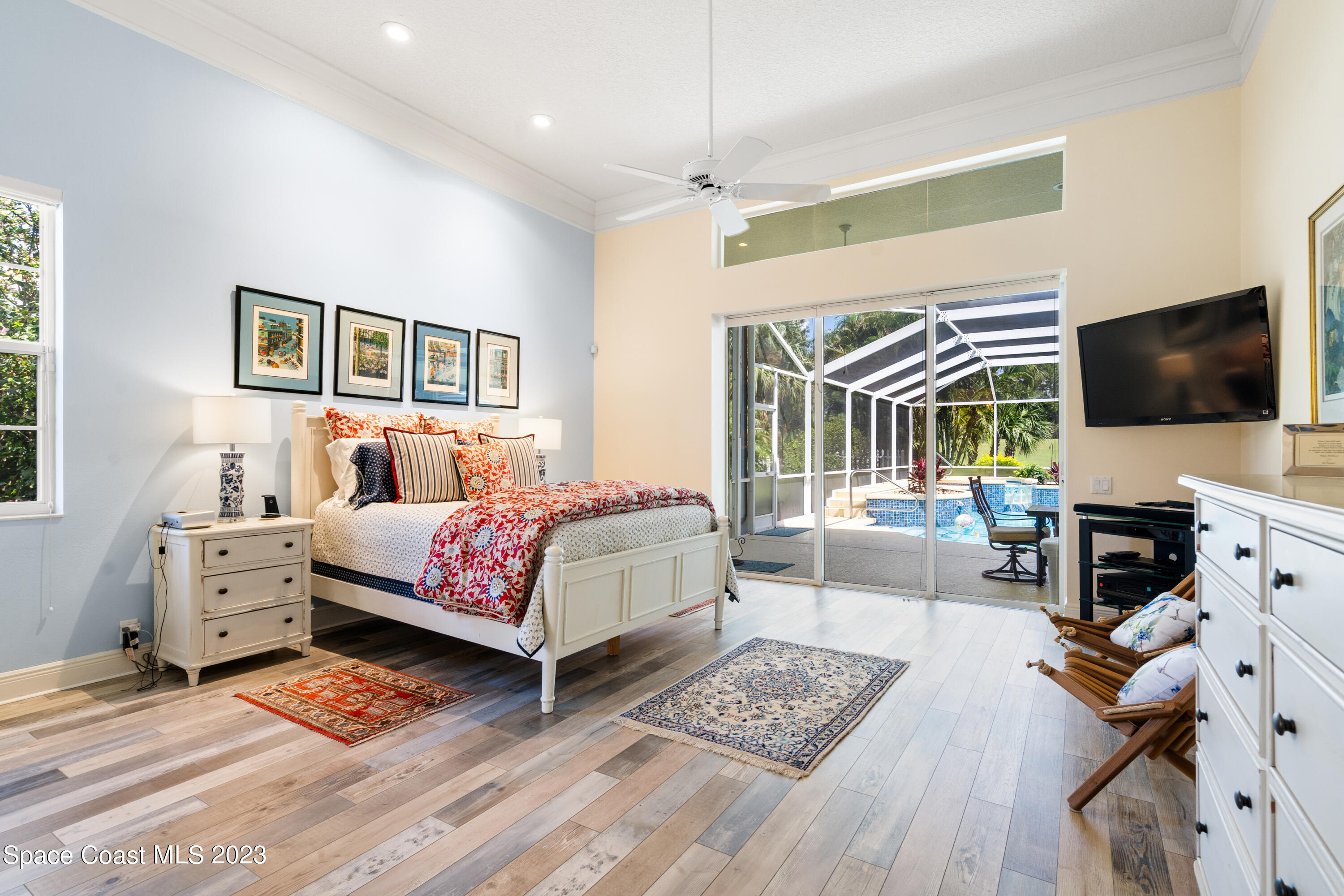 Undisclosed Address Vero Beach, FL 32967 - Photo 20 of 36 a bedroom with a bed and wooden floor