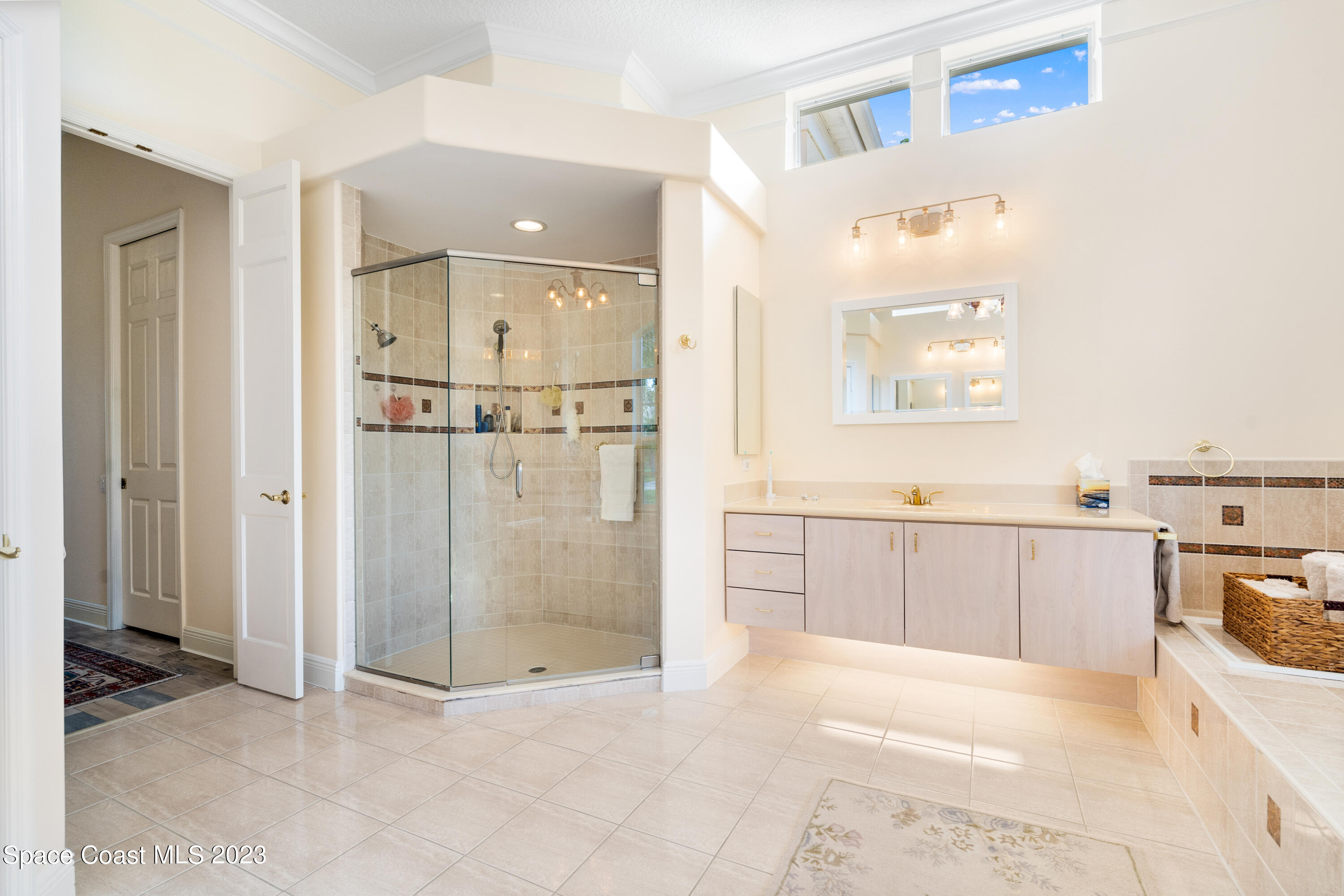 Undisclosed Address Vero Beach, FL 32967 - Photo 22 of 36 a view of a bathroom with sink shower and bathtub