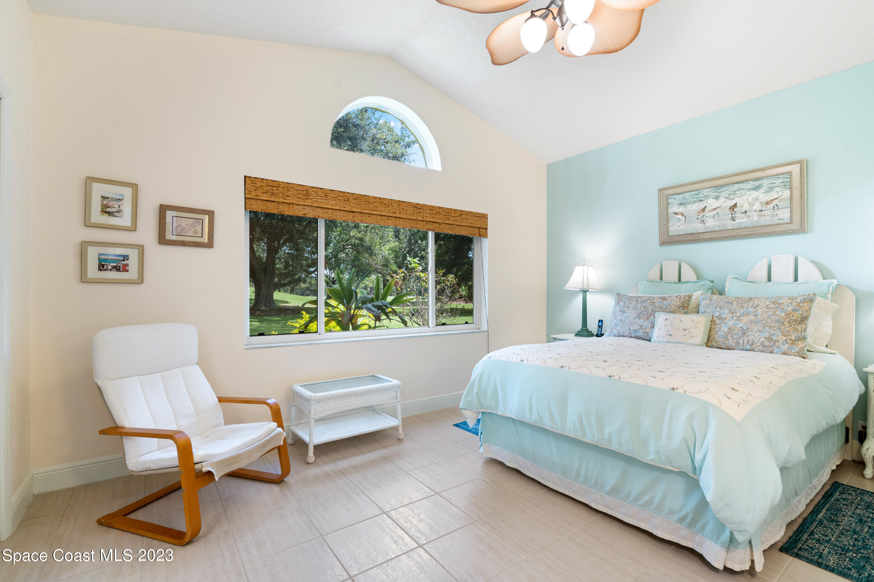 Undisclosed Address Vero Beach, FL 32967 - Photo 23 of 36 a bedroom with a bed and a large window