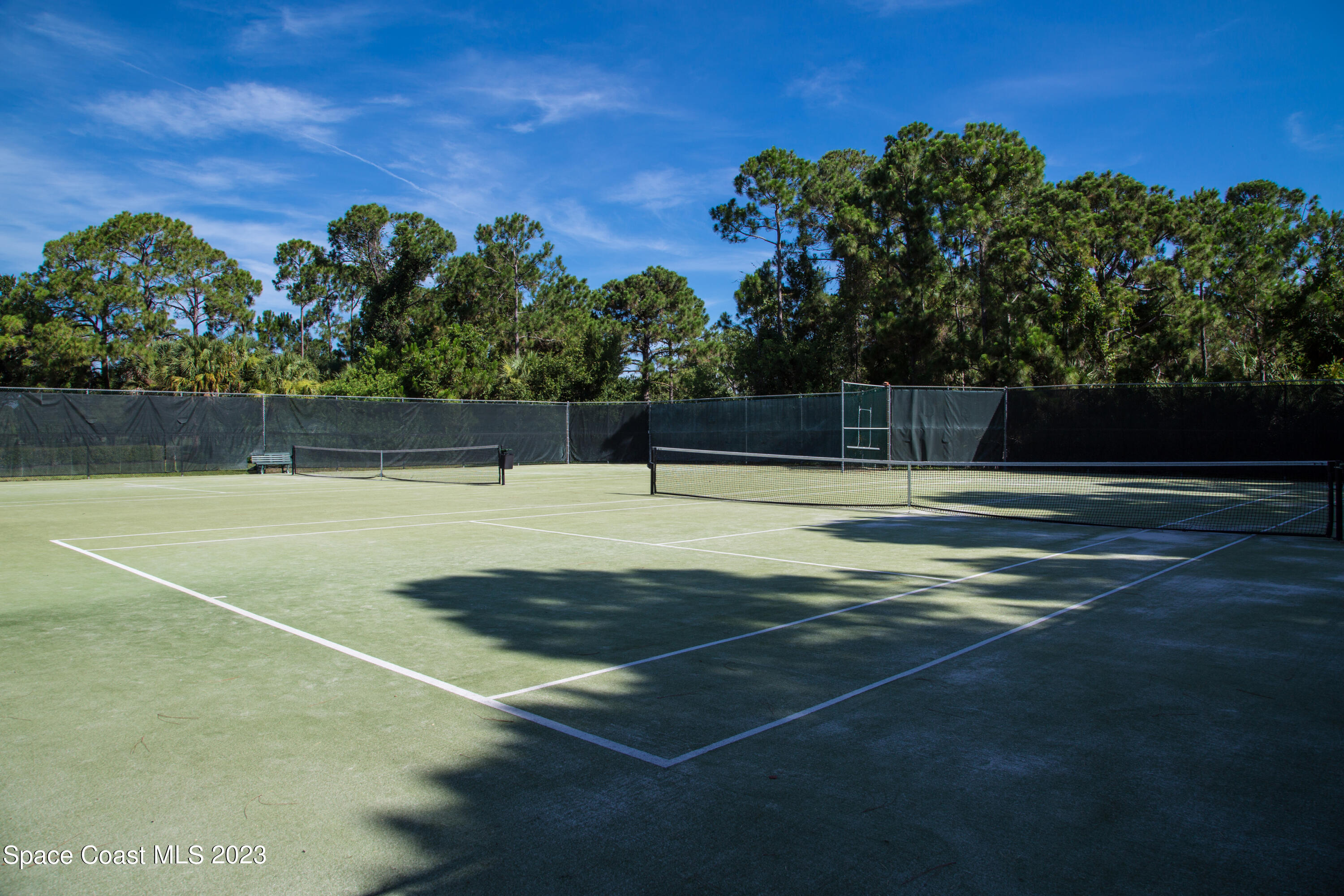 Undisclosed Address Vero Beach, FL 32967 - Photo 34 of 36 a swimming pool with trees in the background