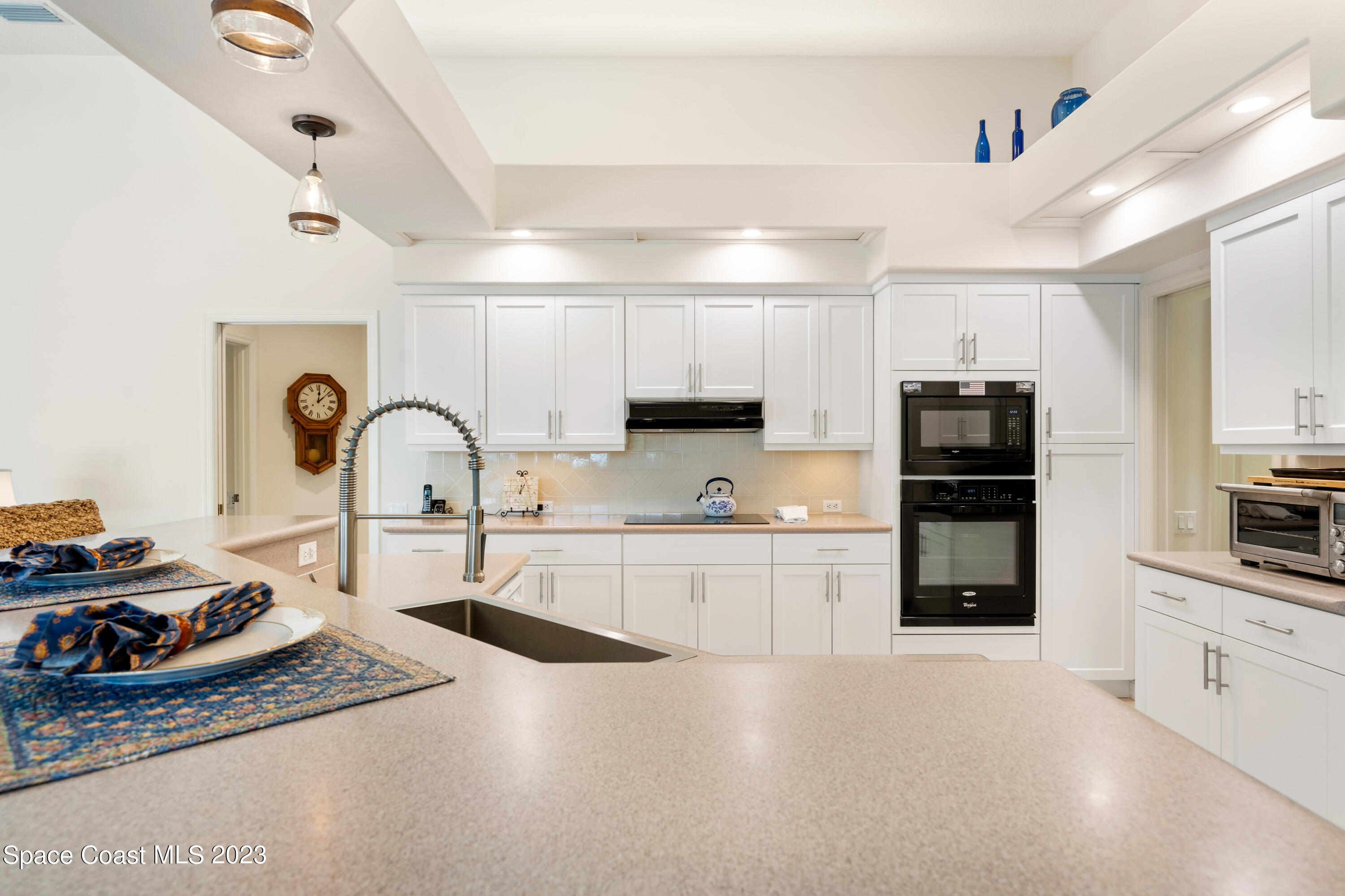 Undisclosed Address Vero Beach, FL 32967 - Photo 7 of 36 a kitchen with stainless steel appliances granite countertop a sink a stove and cabinets