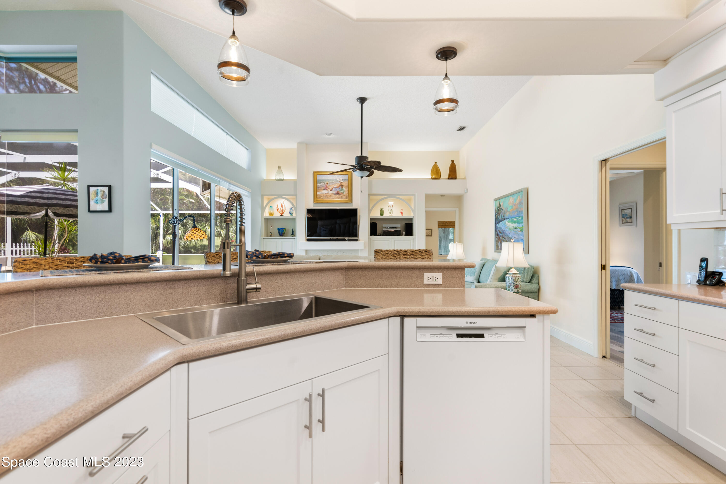 Undisclosed Address Vero Beach, FL 32967 - Photo 8 of 36 a kitchen with cabinets a sink and a stove
