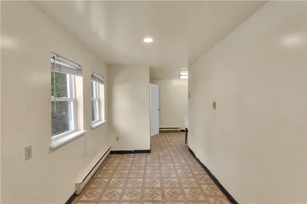 a view of a hallway with windows