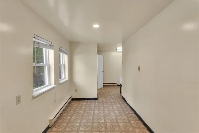 a view of a hallway with windows