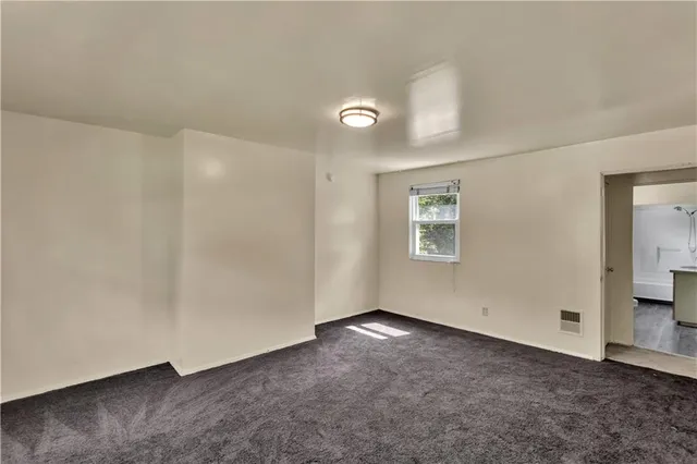 an empty room with a bathroom