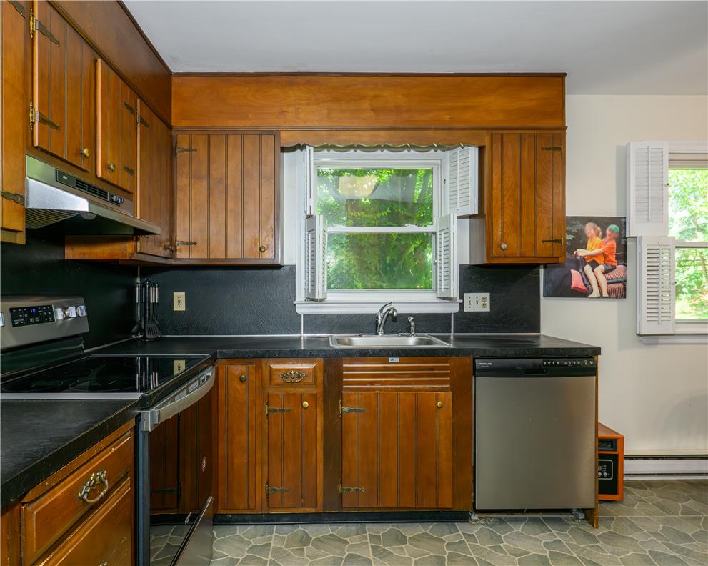 2516 Rachael Lane Orefield, PA 18069 - Photo 6 of 45 A classic kitchen with wooden cabinetry and ample counter space.