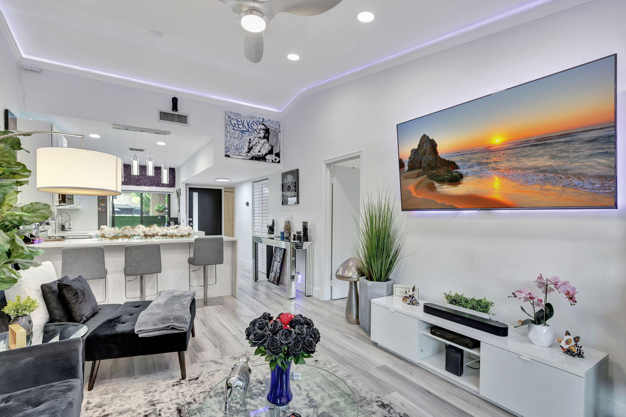 2320 Northwest 37th Avenue, Unit D29 Coconut Creek, FL 33066 - Photo 14 of 27 a living room with furniture and flowers