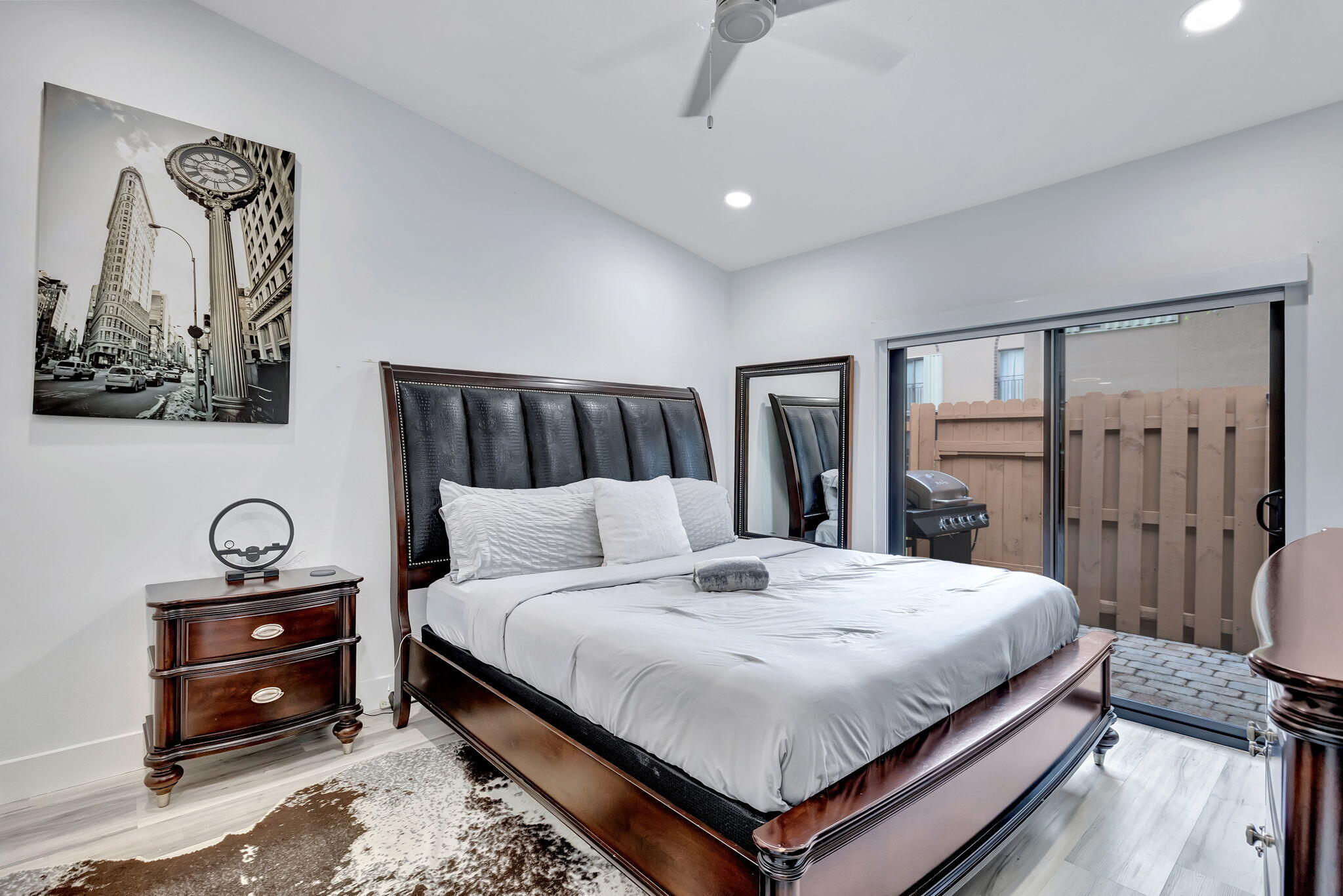 2320 Northwest 37th Avenue, Unit D29 Coconut Creek, FL 33066 - Photo 15 of 27 a bedroom with a bed and a chandelier