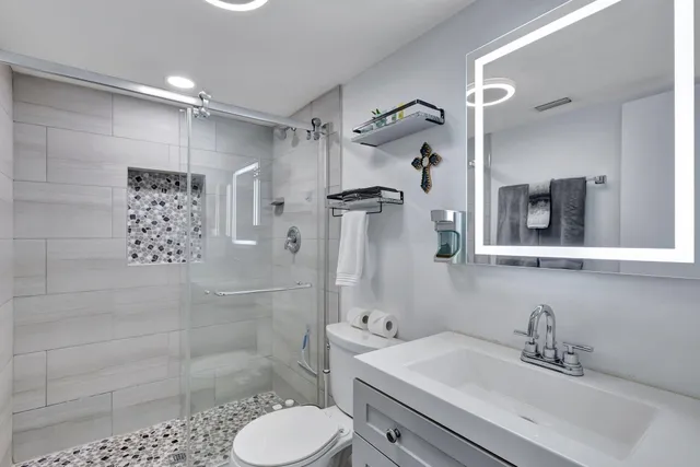 a bed room with a large bed and a couch