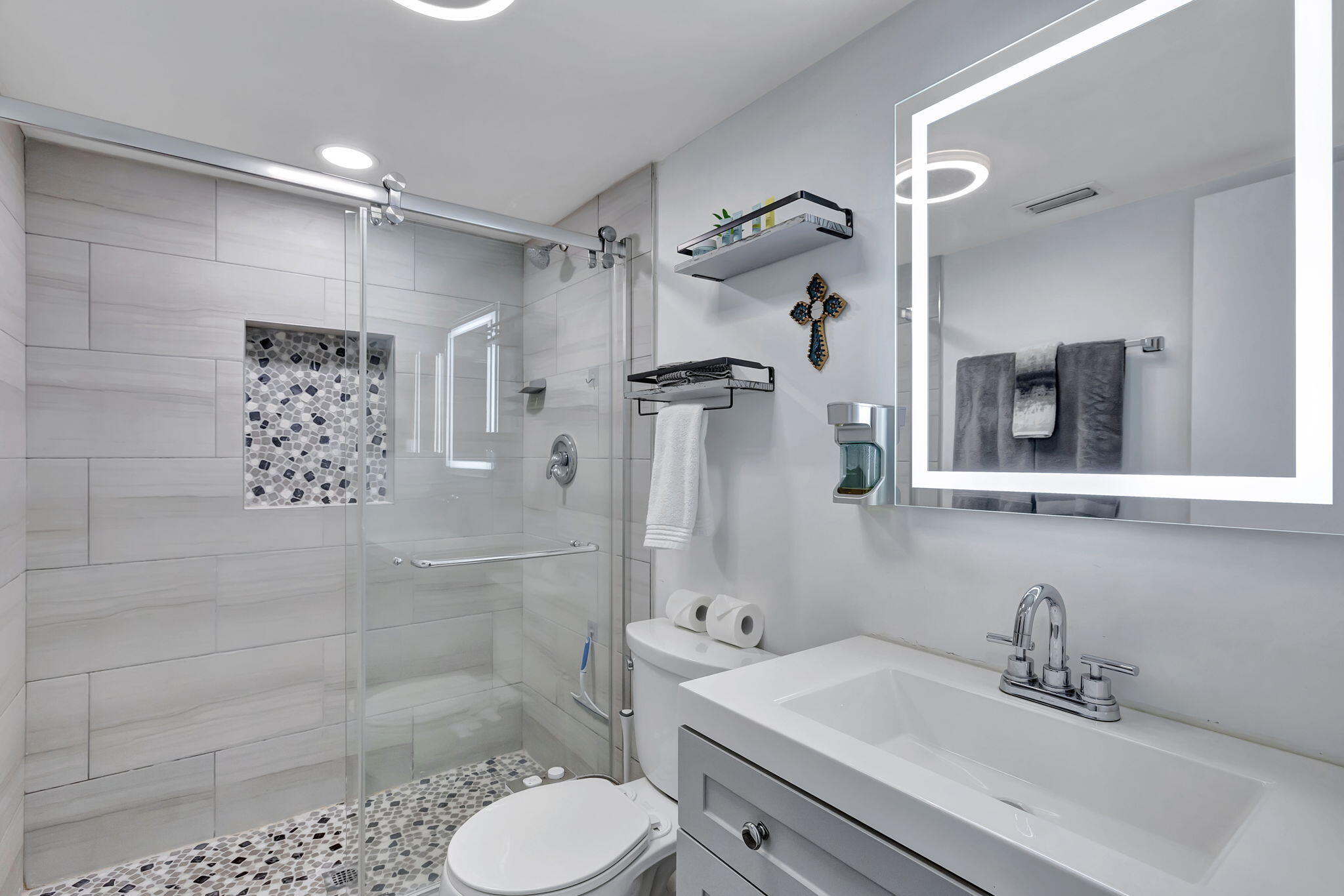 2320 Northwest 37th Avenue, Unit D29 Coconut Creek, FL 33066 - Photo 17 of 27 a bathroom with a sink toilet and shower