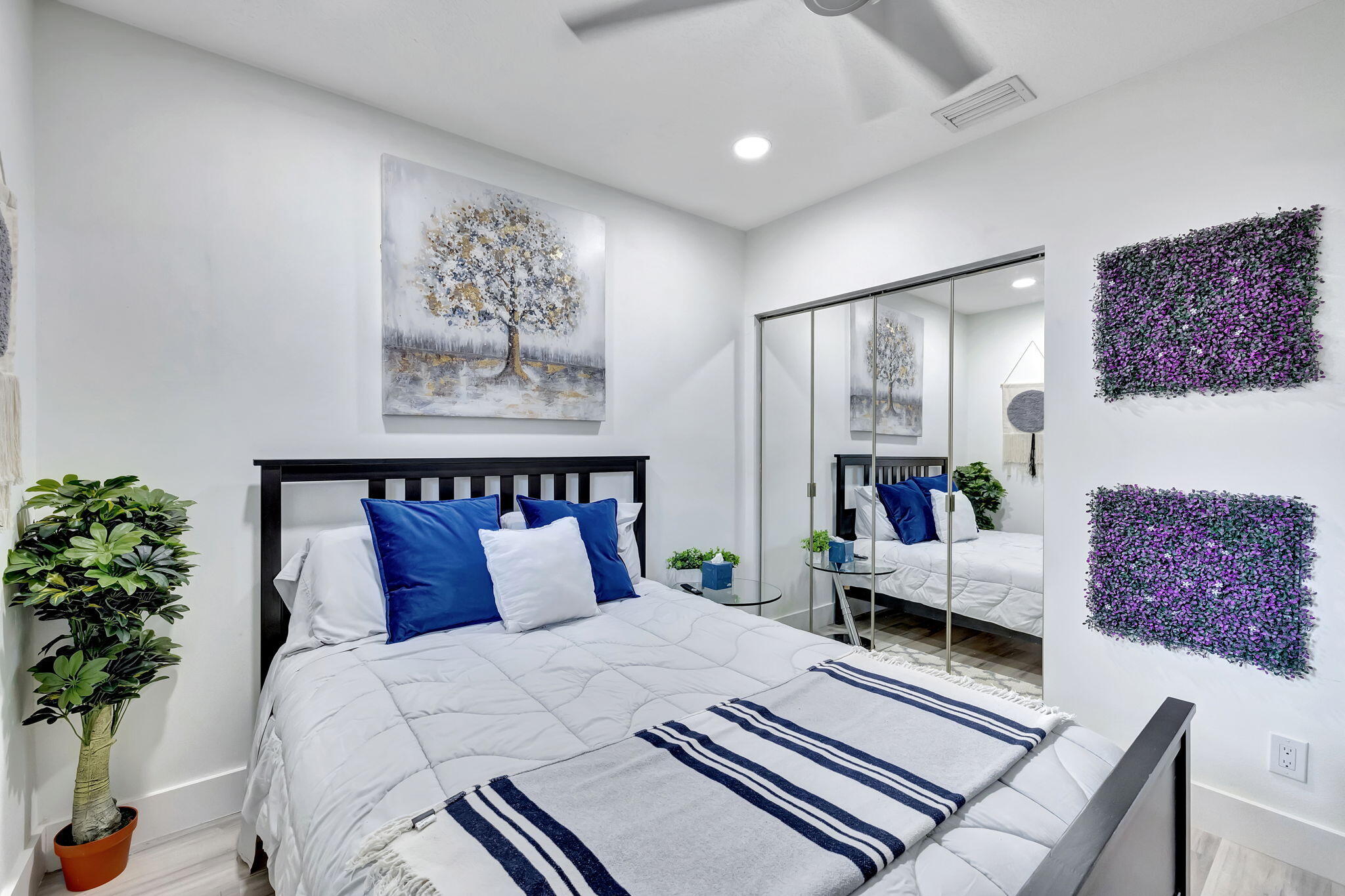 2320 Northwest 37th Avenue, Unit D29 Coconut Creek, FL 33066 - Photo 19 of 27 a bed room with a large bed and a couch