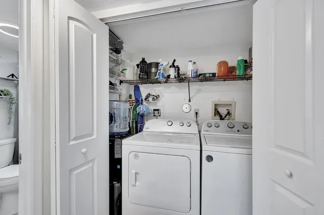 a white bench sitting in front of a door