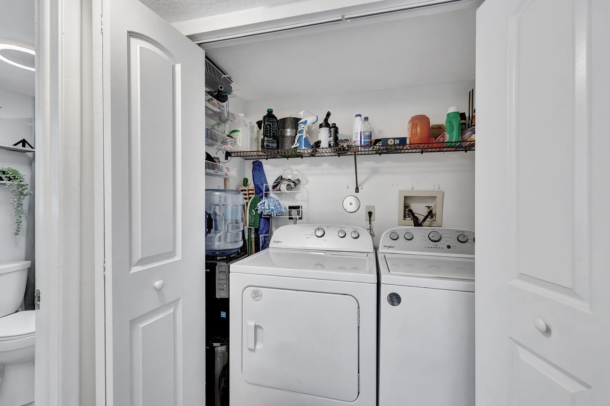 2320 Northwest 37th Avenue, Unit D29 Coconut Creek, FL 33066 - Photo 21 of 27 a view of storage and utility room with washer and dryer