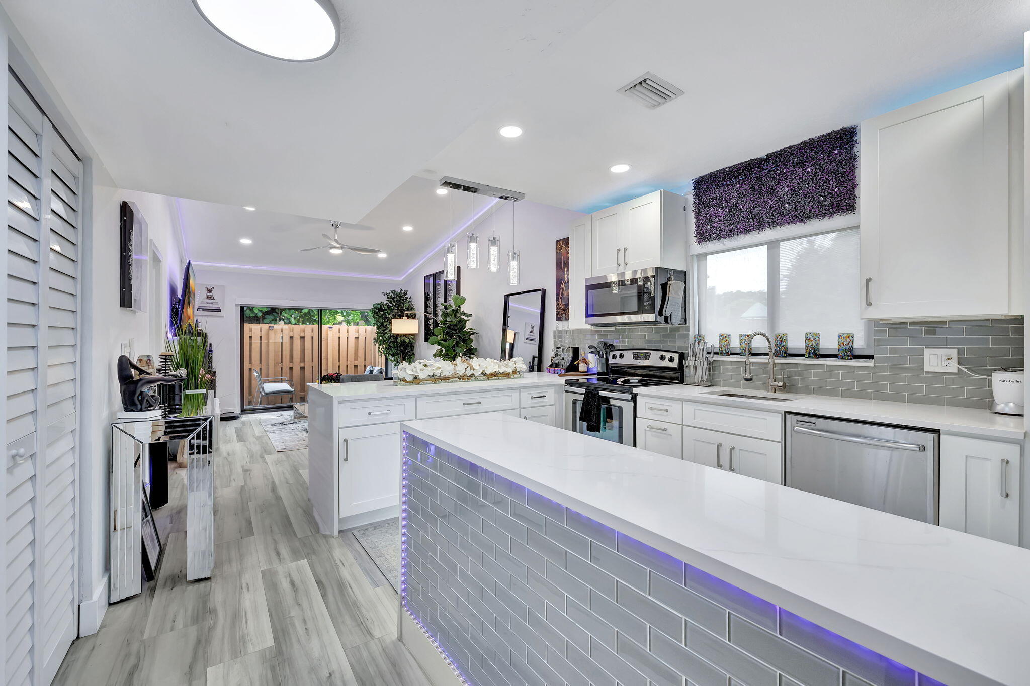 2320 Northwest 37th Avenue, Unit D29 Coconut Creek, FL 33066 - Photo 3 of 27 a kitchen with a sink stainless steel appliances and counter space