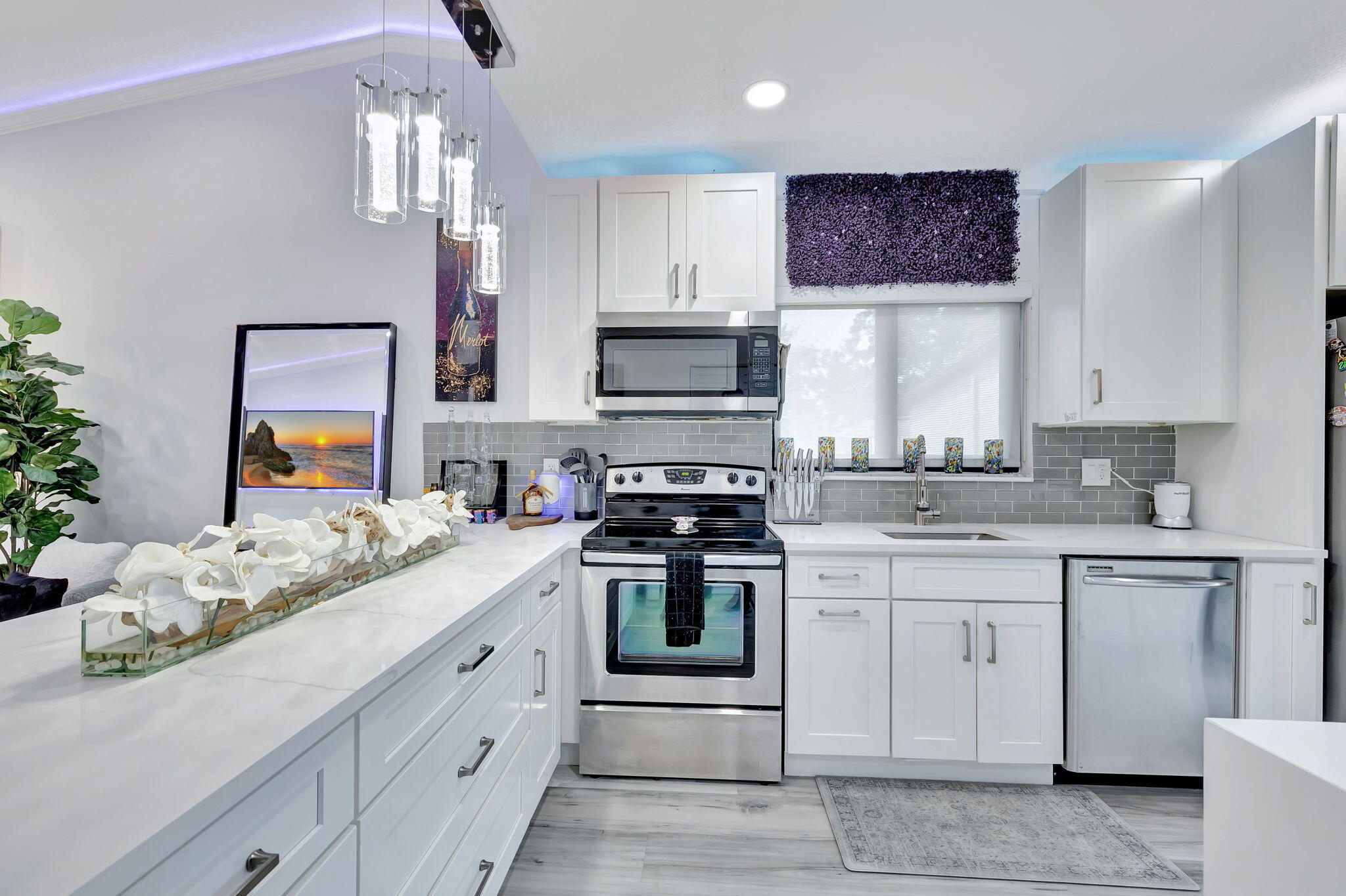 2320 Northwest 37th Avenue, Unit D29 Coconut Creek, FL 33066 - Photo 9 of 27 a kitchen with a sink stove and microwave