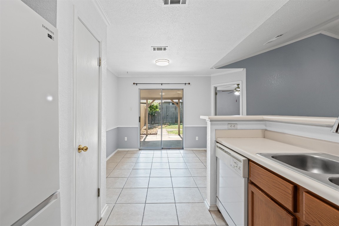 4707 Ridge Way Drive Temple, TX 76502 - Photo 12 of 29 a kitchen with a sink and a refrigerator