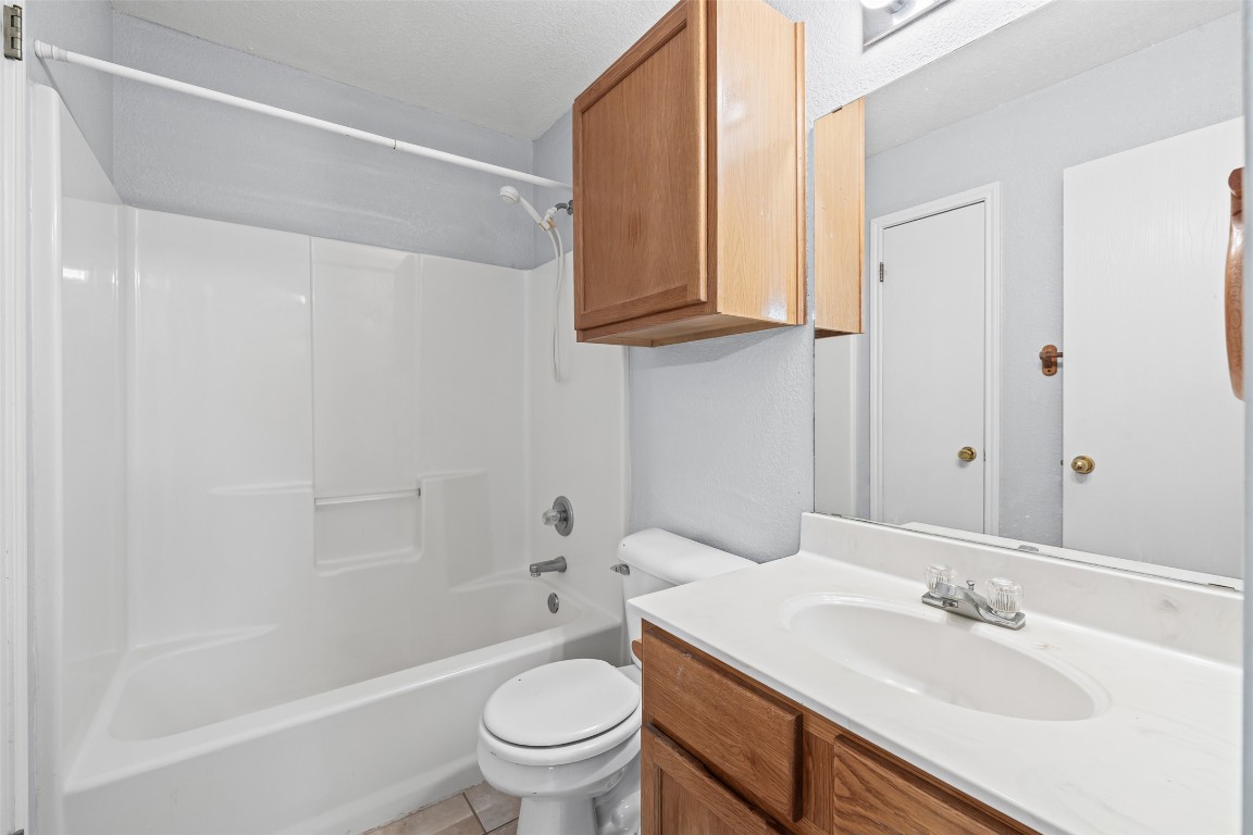 4707 Ridge Way Drive Temple, TX 76502 - Photo 18 of 29 a bathroom with a granite countertop sink toilet and mirror
