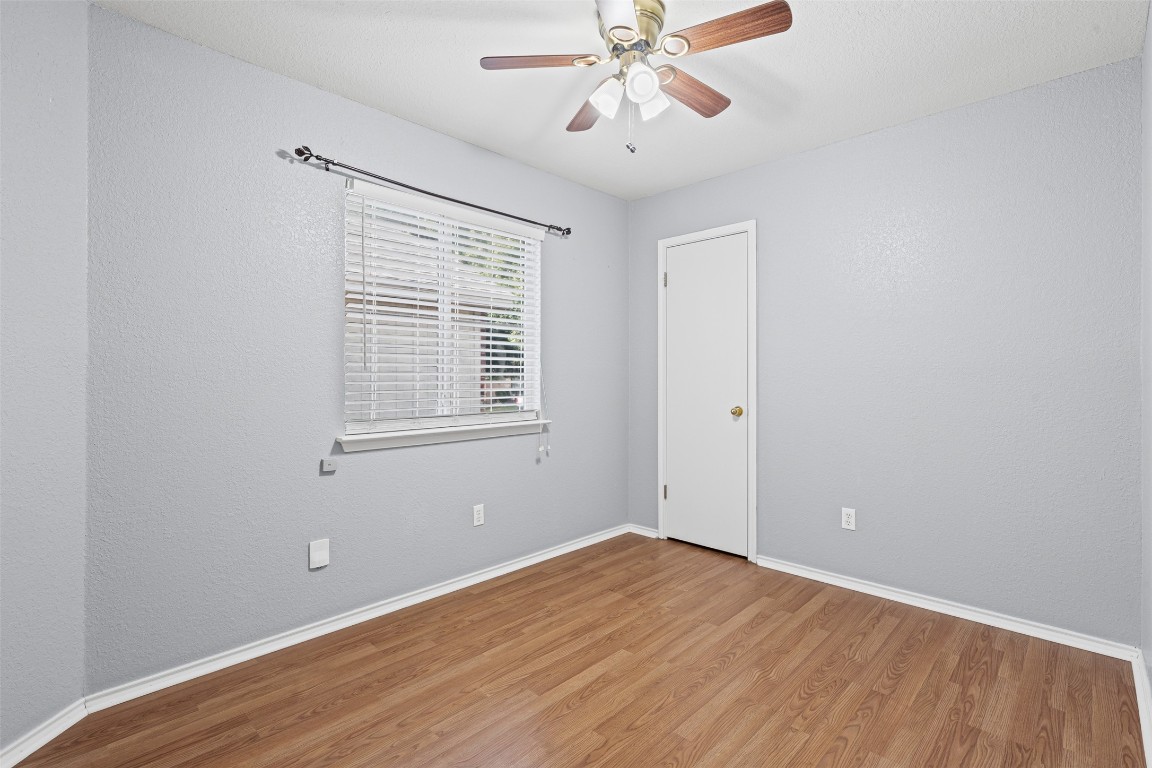4707 Ridge Way Drive Temple, TX 76502 - Photo 19 of 29 wooden floor in an empty room with a window