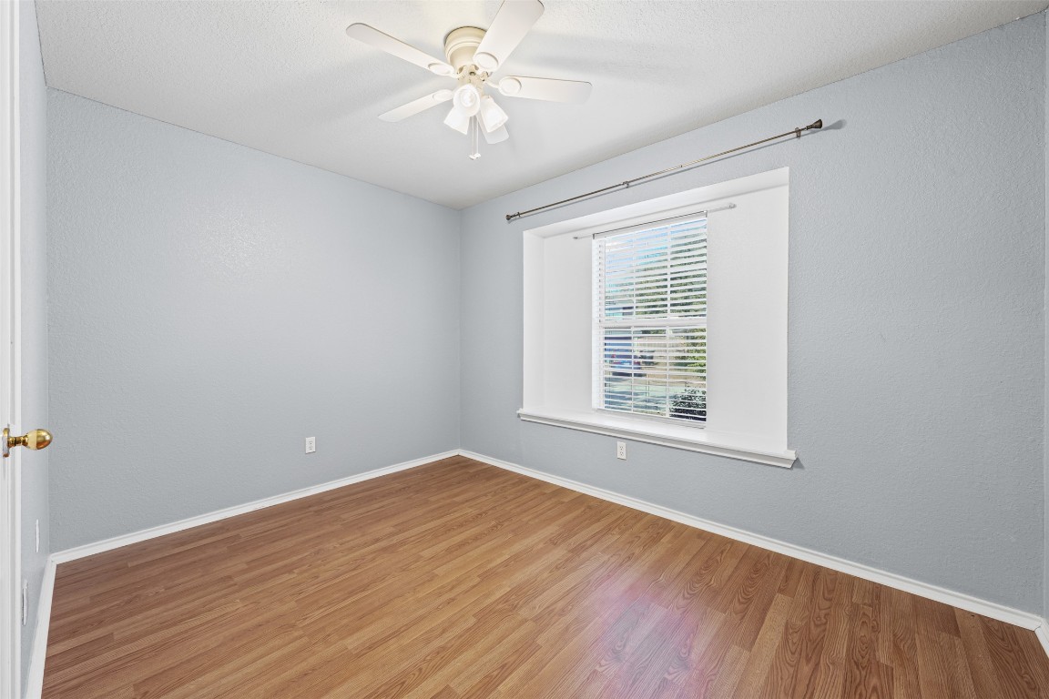 4707 Ridge Way Drive Temple, TX 76502 - Photo 20 of 29 a view of an empty room with wooden floor and a window
