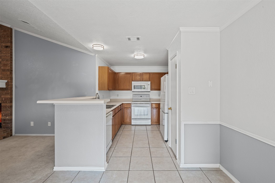 4707 Ridge Way Drive Temple, TX 76502 - Photo 9 of 29 a kitchen with a refrigerator and a stove top oven
