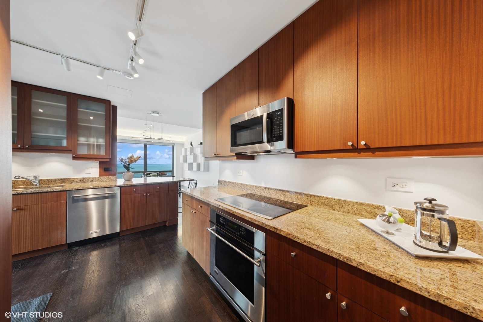 130 North Garland Court, Unit 4101 Chicago, IL 60602 - Photo 11 of 49 a kitchen with granite countertop stainless steel appliances and wooden cabinets