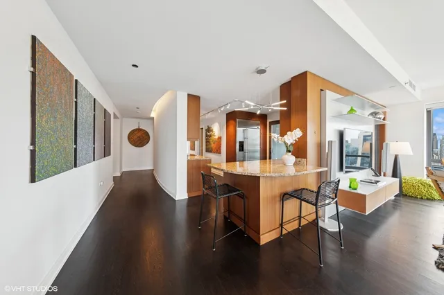 a view of a livingroom with furniture and wooden floor