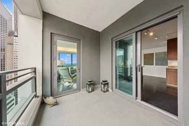 a bedroom with a bed and large window