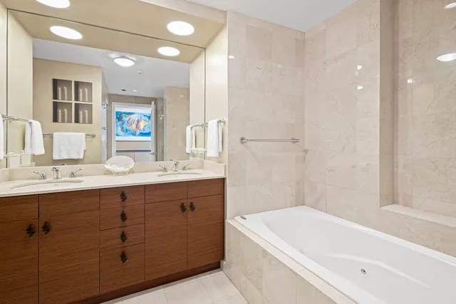 a bathroom with a bathtub and a shower