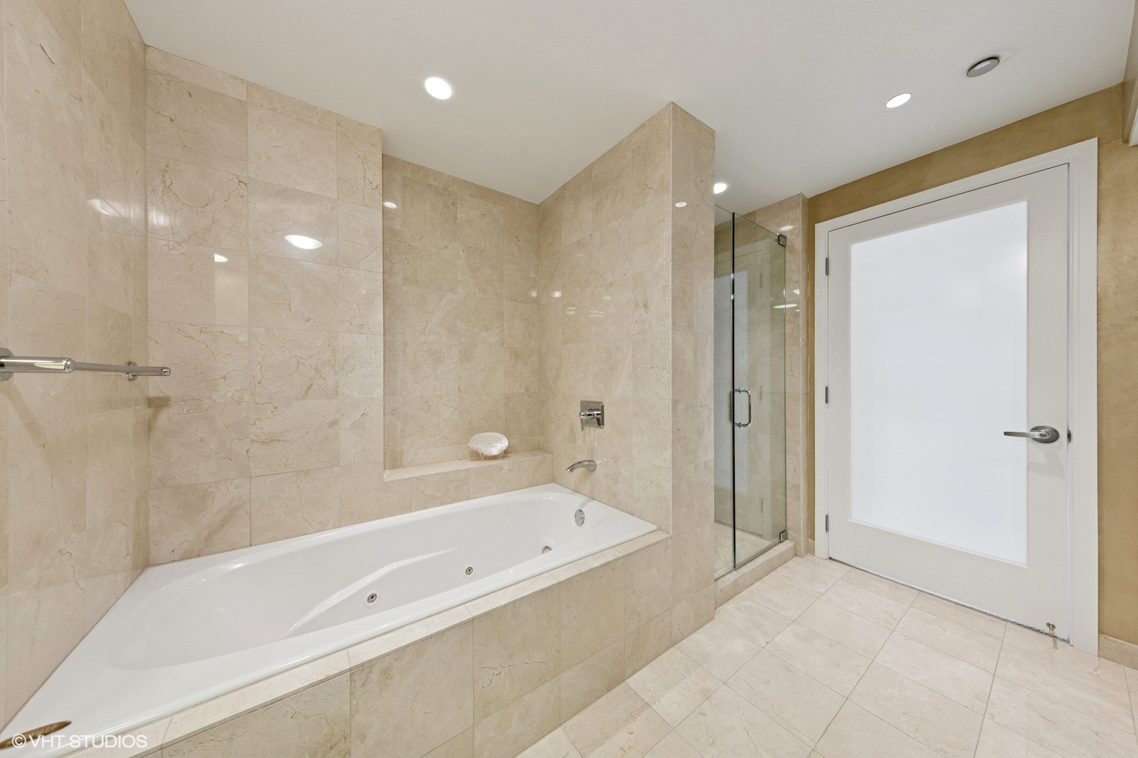 130 North Garland Court, Unit 4101 Chicago, IL 60602 - Photo 21 of 49 a bathroom with a bathtub and a shower