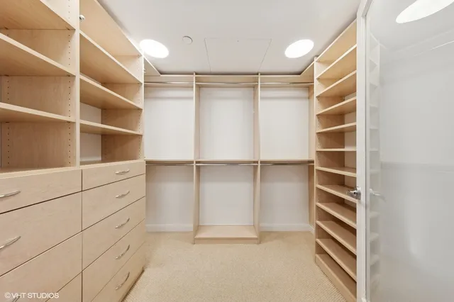 a bedroom with a large bed and a large window