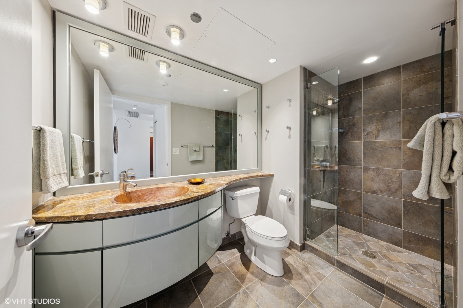 130 North Garland Court, Unit 4101 Chicago, IL 60602 - Photo 27 of 49 a bathroom with a sink toilet and shower