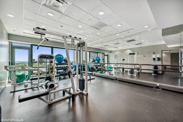 a building outdoor space with patio furniture and potted plants