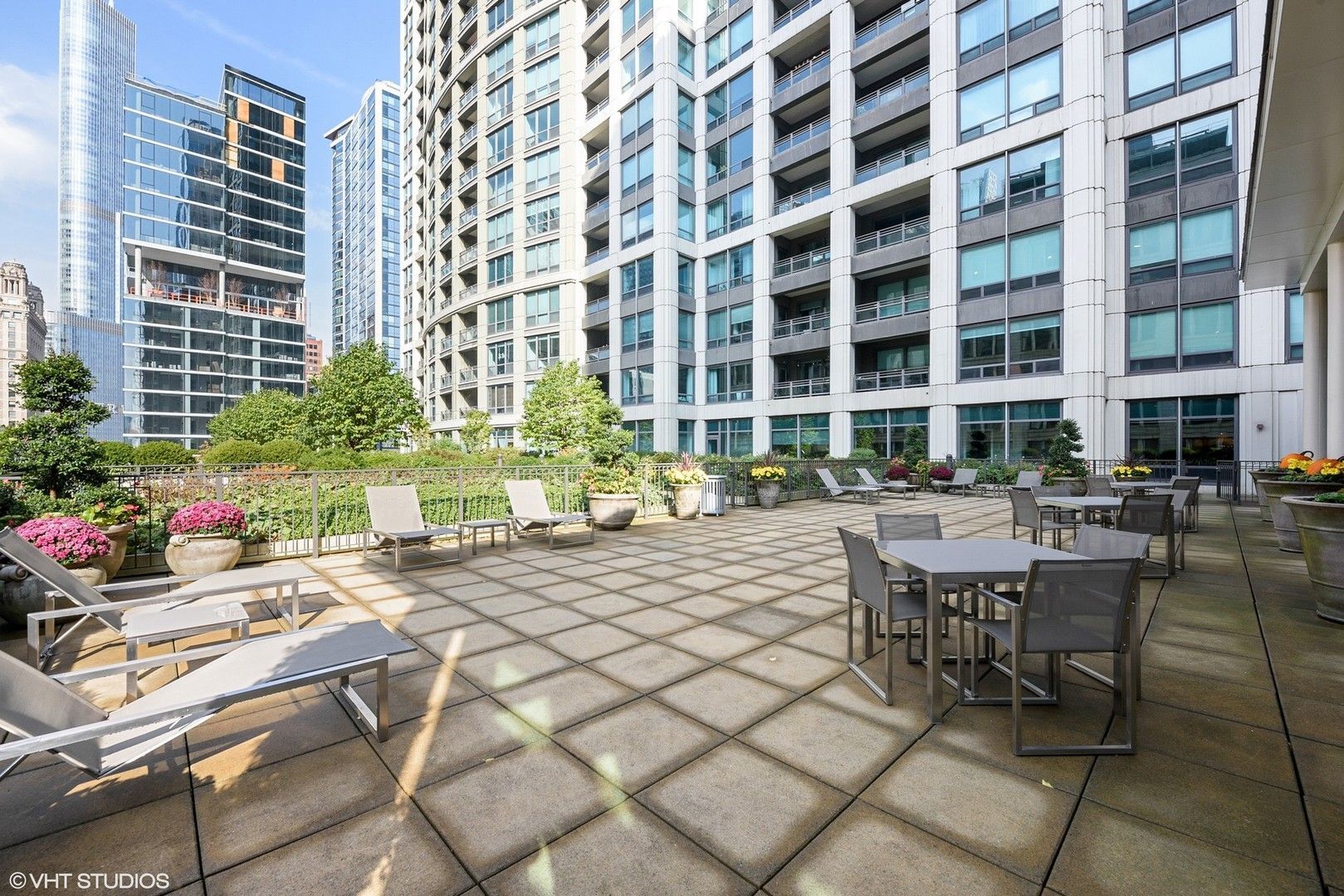 130 North Garland Court, Unit 4101 Chicago, IL 60602 - Photo 37 of 49 a building outdoor space with patio furniture and potted plants