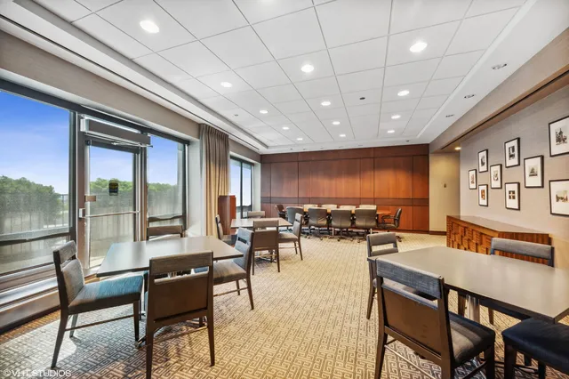 a lobby with furniture and rug