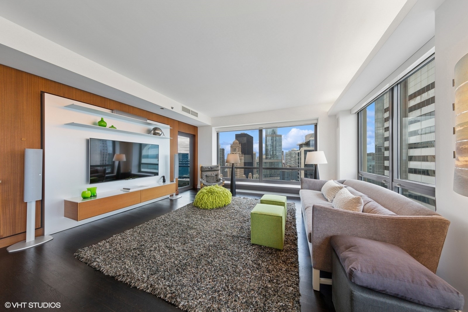 130 North Garland Court, Unit 4101 Chicago, IL 60602 - Photo 6 of 49 a living room with furniture and a flat screen tv
