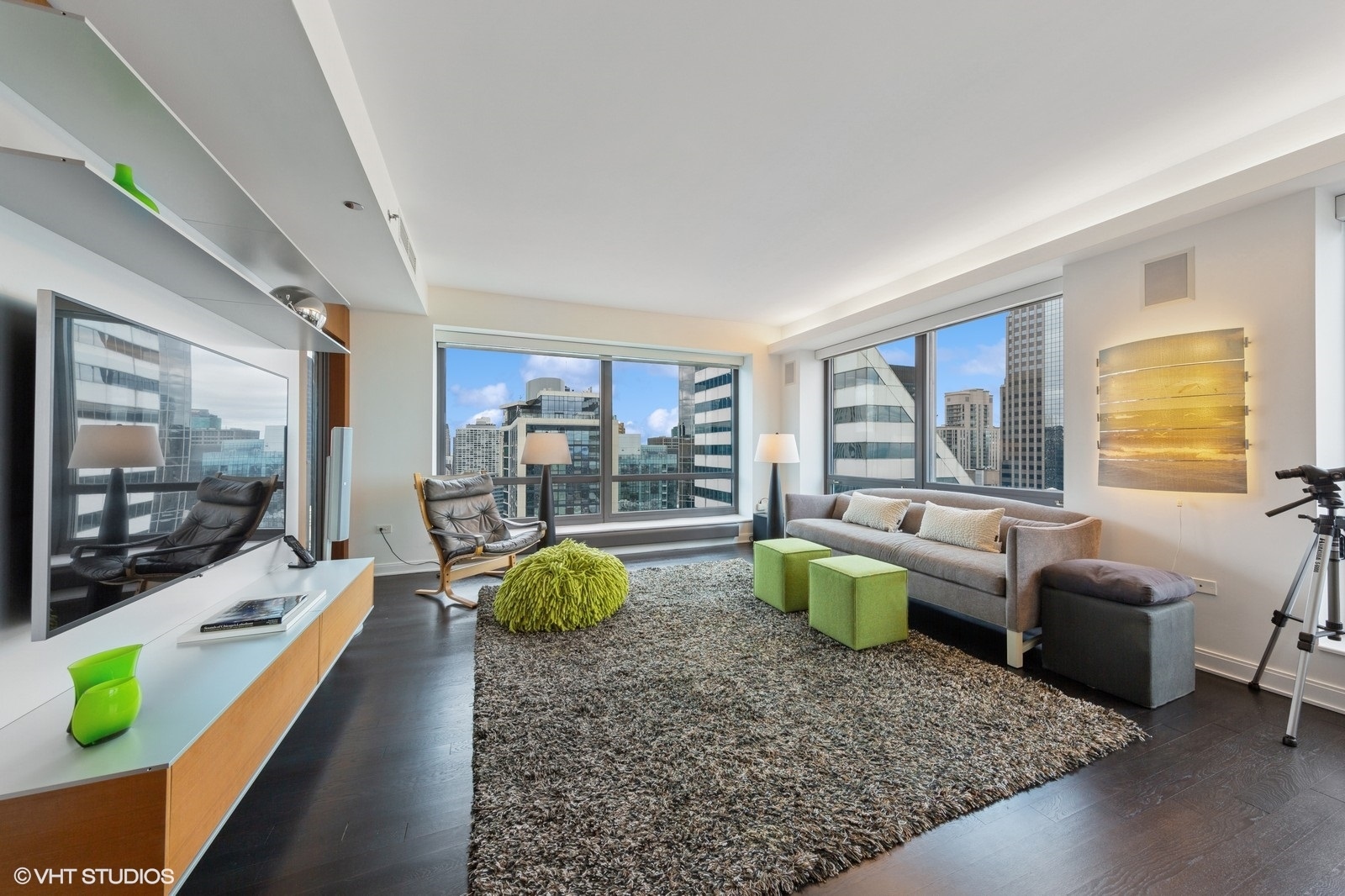 130 North Garland Court, Unit 4101 Chicago, IL 60602 - Photo 7 of 49 a living room with furniture and a flat screen tv