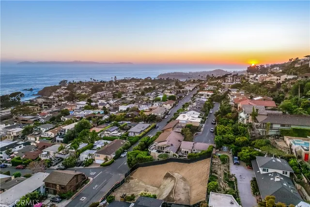 an aerial view of residential house with outdoor space and swimming pool