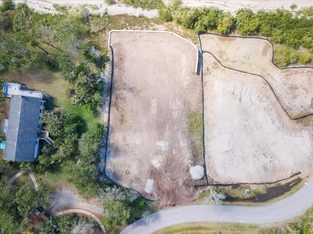 a view of a house with a yard and a garage