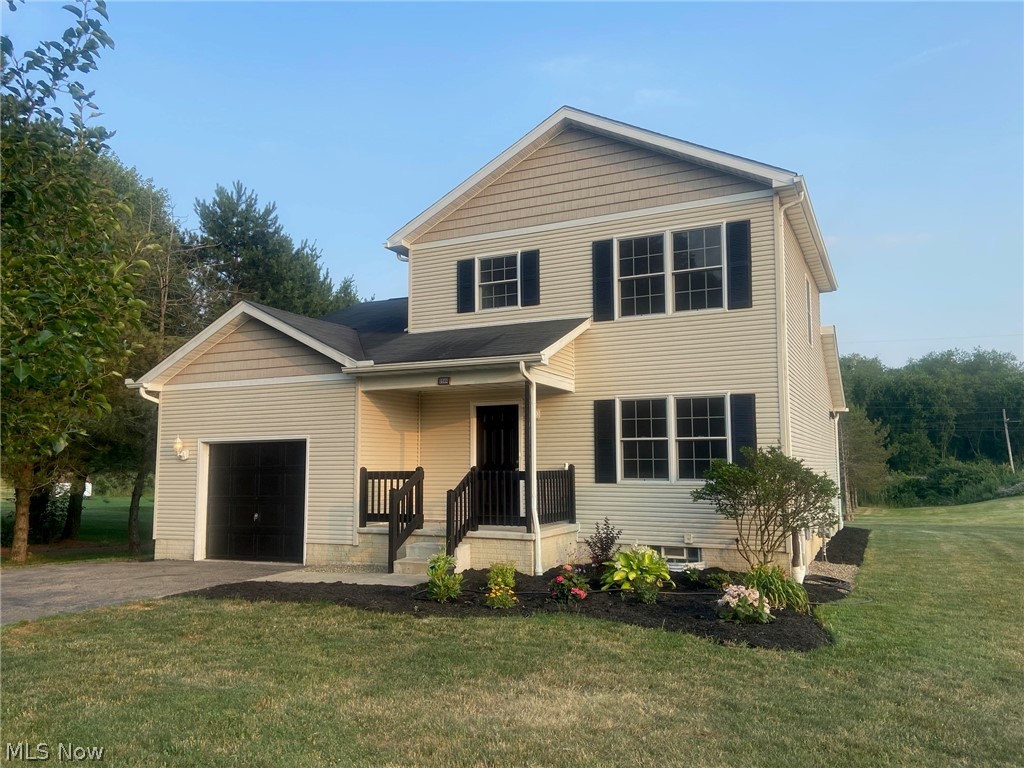 2594 Kibler Road Akron, OH 44320 - Photo 1 of 22 View of property with a garage and a front lawn