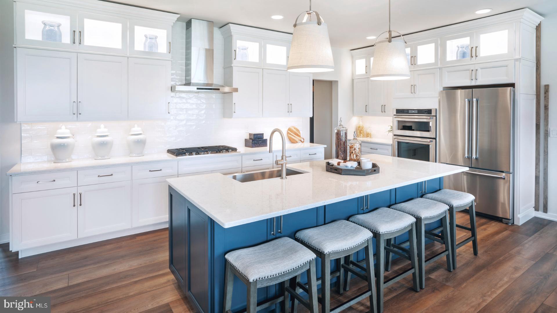 6103 Vivaldi Road Princeton, NJ 08540 - Photo 2 of 8 a kitchen with a dining table chairs cabinets and stainless steel appliances